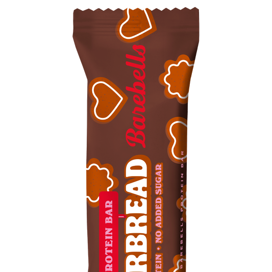 A single Barebells Gingerbread soft protein bar wrapper in brown with red and white text and cookie-shaped graphics, shown on a plain white background.